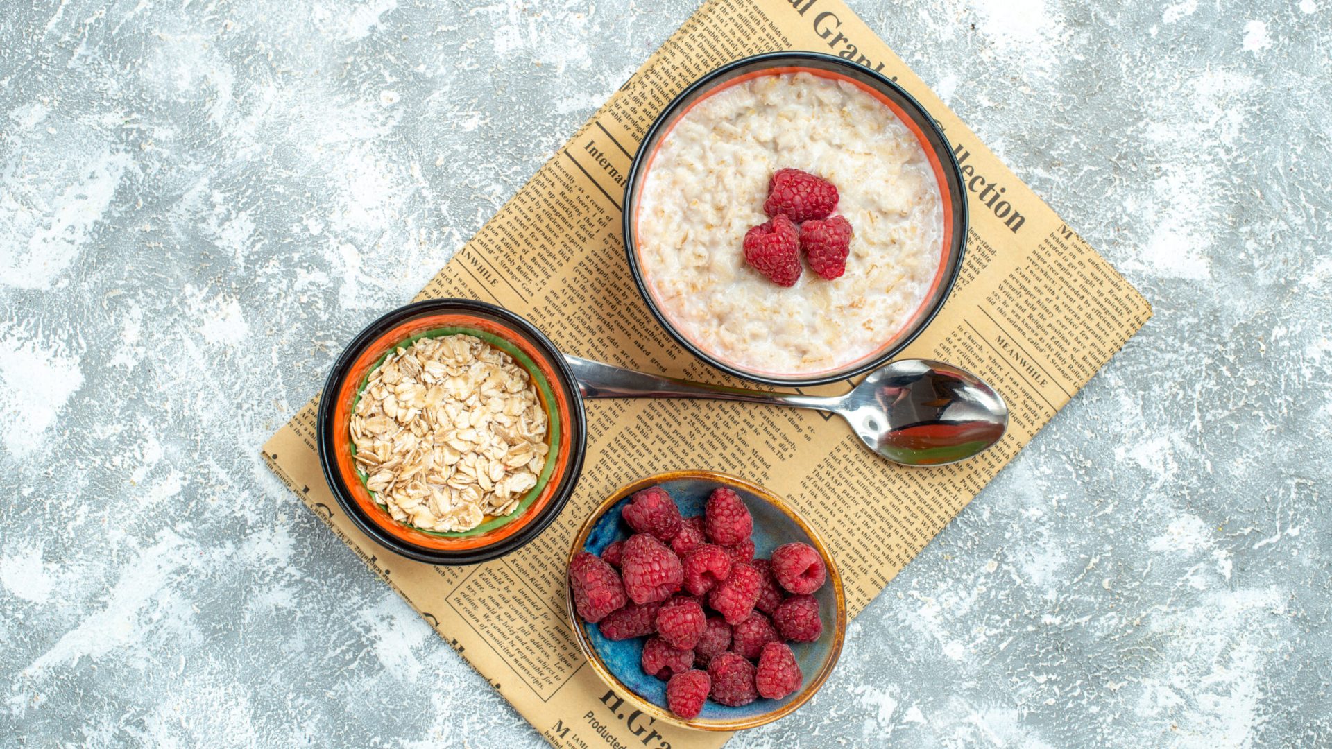 top-view-delicious-porridge-with-raspberries-light-background top-view-delicious-porridge-with-raspberries-light-background